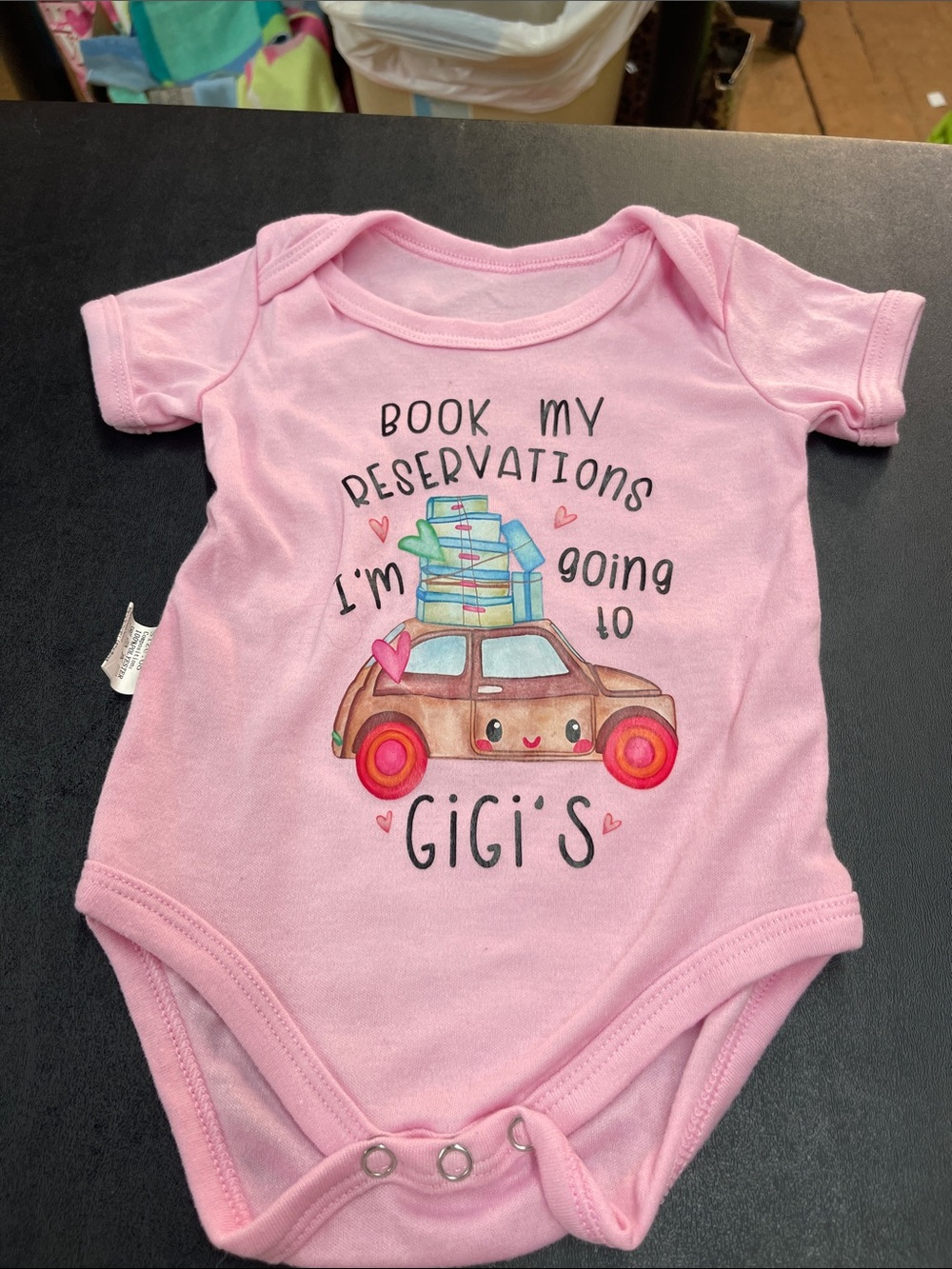 Pink Baby Bodysuit with 'I'm Going to Gigi's' Graphic